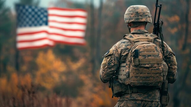 Soldier Standing at Attention with American Flag in the Background