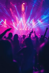 Silhouetted Concert Crowd Illuminated by Pink and Blue Stage Lights