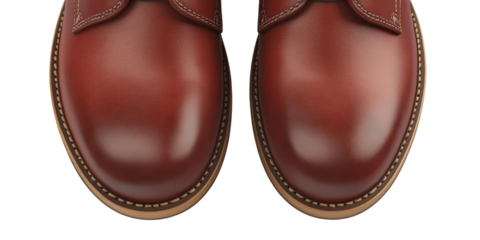 Glossy brown leather shoes with detailed stitching on smooth surface creating a stylish and polished appearance for footwear enthusiasts and fashion lovers
