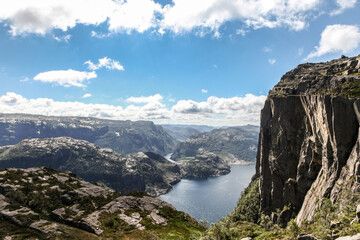 A mountain range in Norway overlooking the Luse Fjord and the Preikestolen ledge.