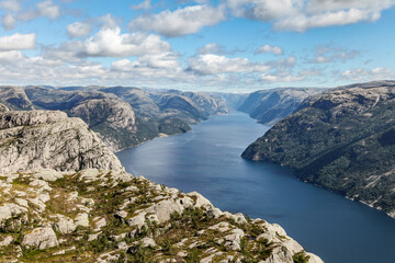 A mountain range in Norway overlooking the Luse Fjord from the Preikestolen side