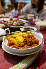 Cantonese-style braised pork trotters with ginger and vinegar, served in a bowl, tender and flavorful, popular traditional dish
