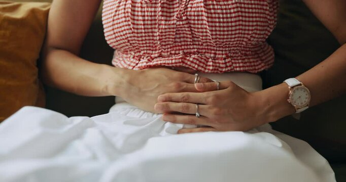 Pain, hands and woman with stomachache, home and menstrual cramps in living room, massage or health. Lounge, uncomfortable and person with pelvic inflammatory disease, abdominal or infection in house