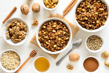 Granola in bowl over white wooden background