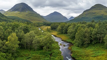 Scenic aerial panorama of Glencoes dramatic highland landscape, covered in lush green vegetation