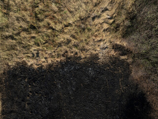 Aerial photo of a burned out field. Grunge texture