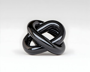 Sleek black glass sculpture, intricately knotted design