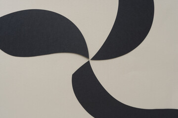 abstract pinwheel background (pointy black paper shapes on beige)