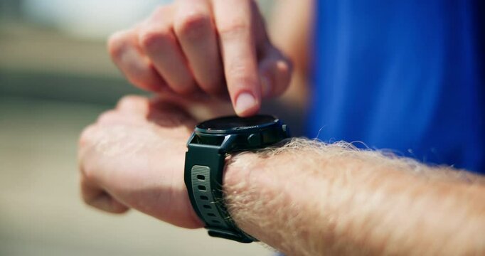Hands, outdoor and man with fitness, smart watch and tracking progress with training. Closeup, person and runner in city, check time and exercise with monitor heart rate, step counter or workout gear