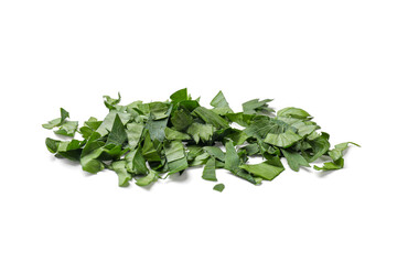 Fototapeta premium Chopped green parsley leaves isolated on white