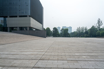 empty concrete ground in front of modern office buildings in downtown. floor for copy space