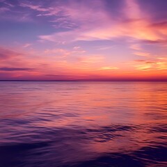 Obraz premium Serene Sunset Over Calm Ocean Waters Reflecting Colors