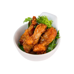 Crispy Hong Kong-style fried chicken wings served on fresh greens, a popular tea restaurant snack with a satisfying crunchy texture