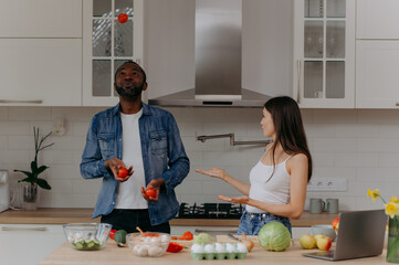 Couple Cooking Together in a Modern Kitchen with Fresh Ingredients