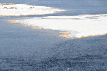 Zaporizhzhia, Ukraine, Khortytsia island. Dnipro river, snow-covered small islands among blue water, cold sunny day. 