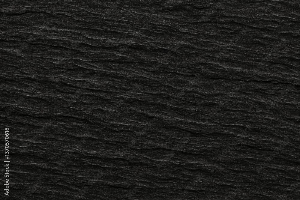 Poster black slate background showcasing a rough and uneven texture, providing a natural yet elegant backdr