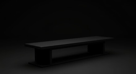 Minimalist black bench seat against dark background in a studio setting
