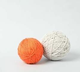 Soft colorful woolen yarns on white background. Space for text