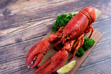Red lobster on wooden cutting board 