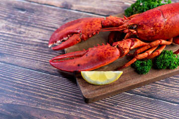 Red lobster on wooden cutting board 