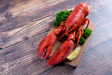 Red lobster on wooden cutting board 