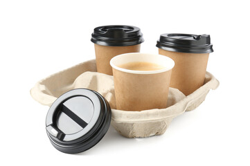 Paper coffee cups in cardboard holder isolated on white