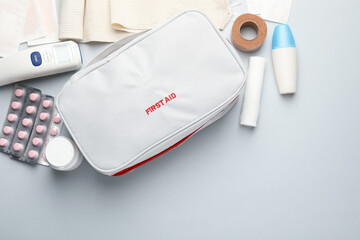 Flat lay composition with first aid kit on gray background