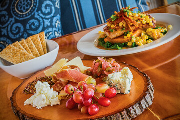charcuterie board with meat, cheese, and fresh fruit
