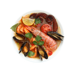 Delicious seafood soup in bowl isolated on white, top view