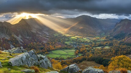 Dramatic sunlight streams over a beautiful landscape of mountains and valleys