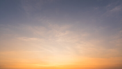 Fototapeta premium Morning sky, Golden sunset beauty sun dawn with Yellow, Orange, Blue sunrise sky background, Sunny bright dramatic cloud heaven sunshine, Horizon romantic fluffy, Landscape twilight sky 