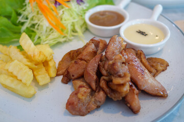 Delicious grilled chicken dish restaurant food bright setting close-up culinary delight