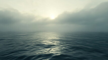 Obraz premium The ocean stretches out under a cloudy and misty sky