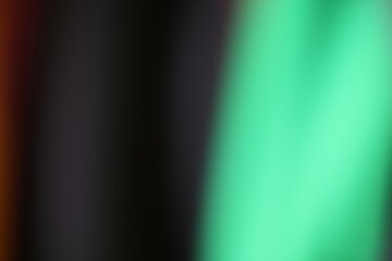 Abstract gradient background with blended dark and light green colors
