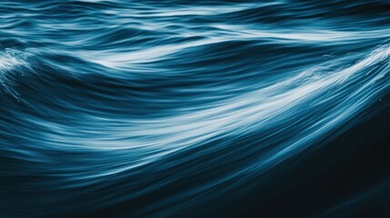 Fototapeta premium Blue Water Surface With White Waves Moving Gently Across The Image
