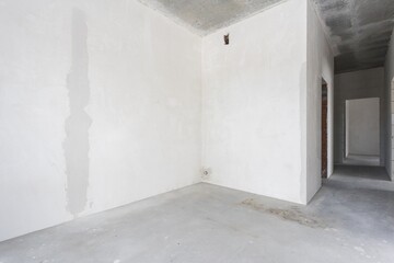 interior of the apartment without decoration in gray colors. rough finish