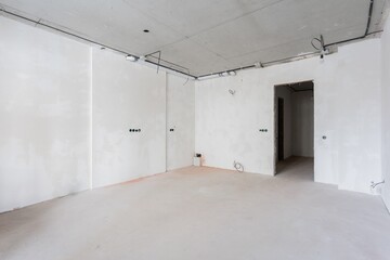 interior of the apartment without decoration in gray colors. rough finish