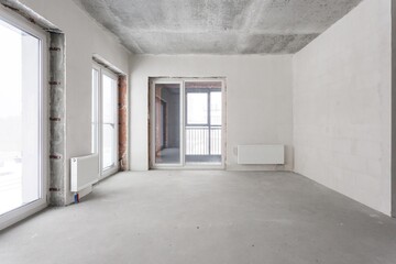 interior of the apartment without decoration in gray colors. rough finish