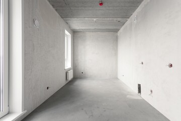 interior of the apartment without decoration in gray colors. rough finish