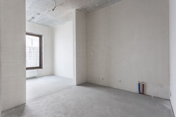 interior of the apartment without decoration in gray colors. rough finish