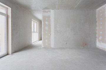 interior of the apartment without decoration in gray colors. rough finish