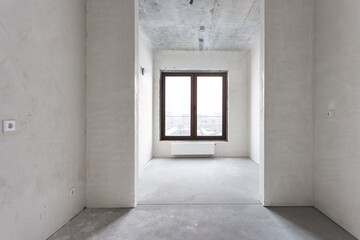 Fototapeta premium interior of the apartment without decoration in gray colors. rough finish