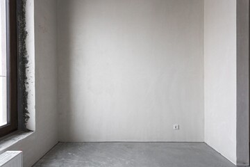 interior of the apartment without decoration in gray colors. rough finish