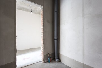interior of the apartment without decoration in gray colors. rough finish