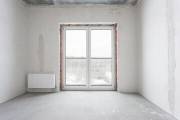 interior of the apartment without decoration in gray colors. rough finish