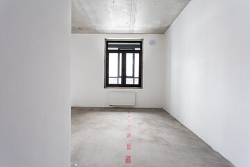 interior of the apartment without decoration in gray colors. rough finish