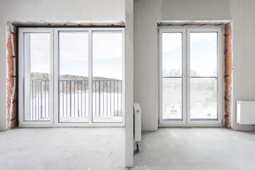 Fototapeta premium interior of the apartment without decoration in gray colors. rough finish