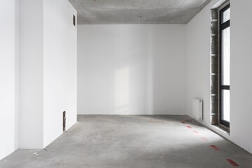 interior of the apartment without decoration in gray colors. rough finish