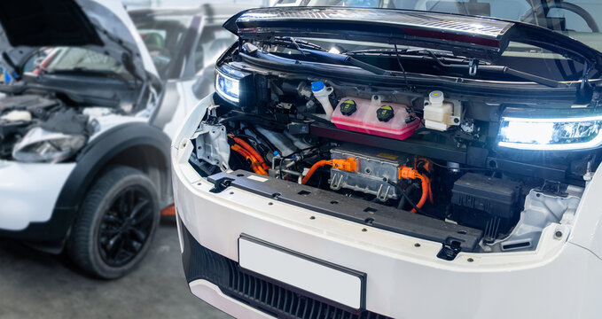 Electric van with open hood. Electric vehicles maintenance..