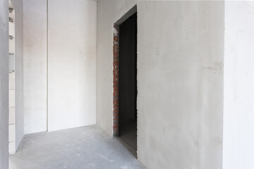 interior of the apartment without decoration in gray colors. rough finish